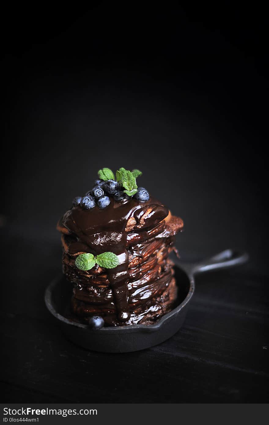 Chocolate Pancakes For Breakfast With Blueberries, Dark Photo. Homemade Baking.