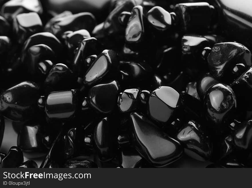 Decorative women`s beads of black stones close-up. Abstract background