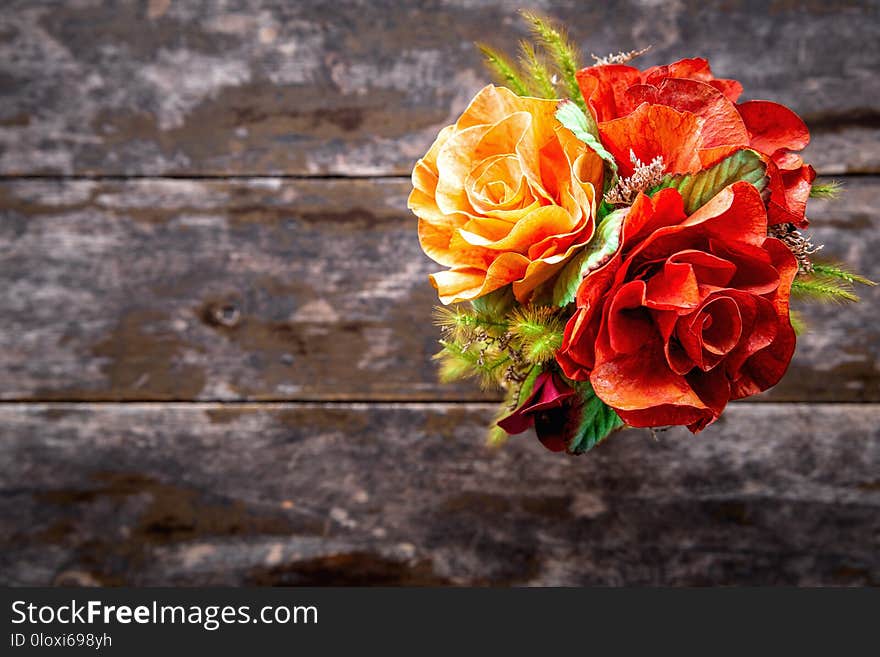 Bouquet of colorful flowers on wooden table