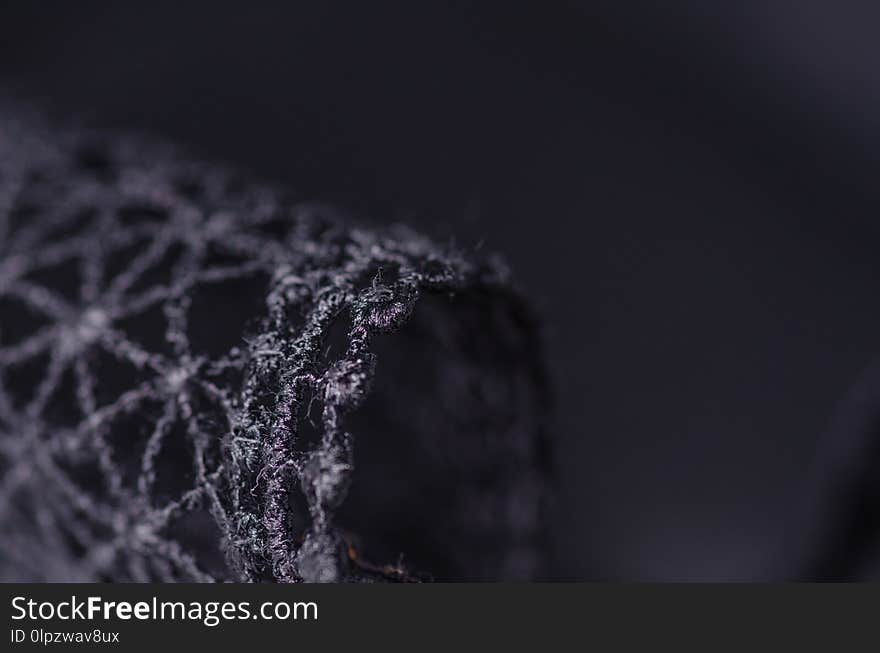 Black swimsuit bra push up seams of a string laces macro background