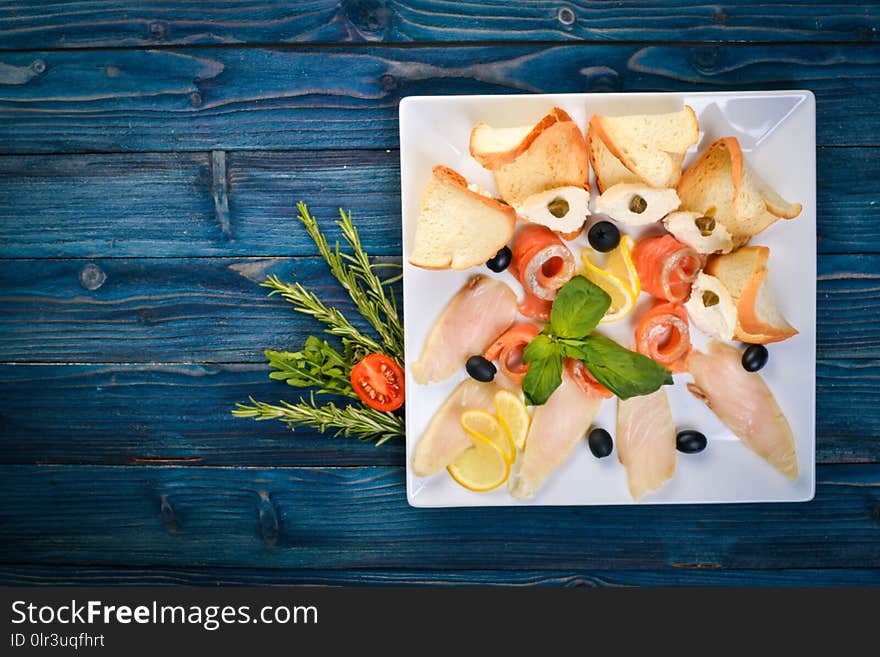 Salt fish. Salmon, pink salmon on a plate. On a wooden background