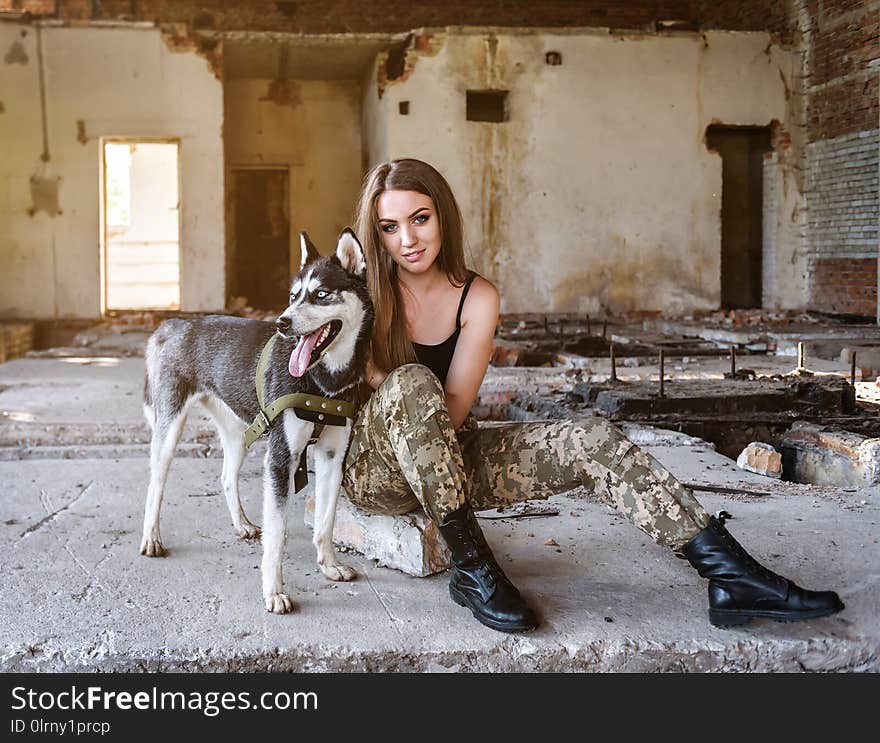 Beautiful military girl with husky