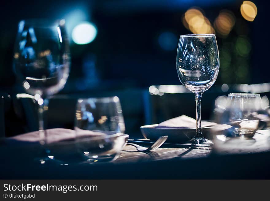 Luxury table settings for fine dining with and glassware, beautiful blurred background. For events, weddings.