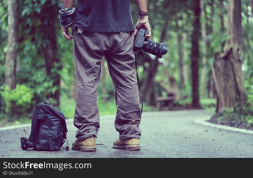 Natural Geology Photographer Standing On Street With A Natural View. Natural Geology Photographer Standing On Street With A Natural View