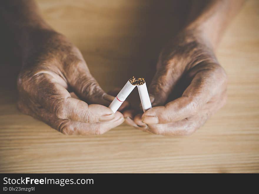 No Smoking Day Concept With Old Male Hand Crushing Cigarette