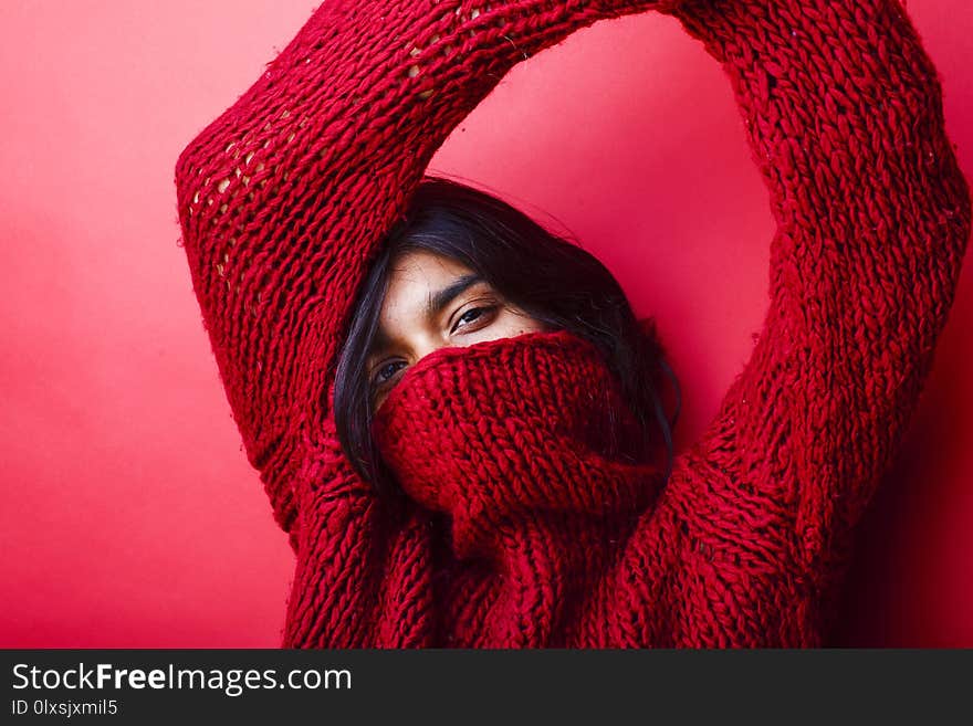 Young Pretty Indian Mulatto Girl In Red Sweater Posing Emotional