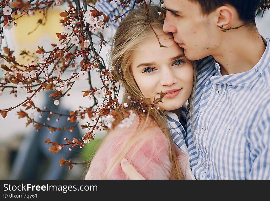 Beautiful young girl with her boyfriend in the summer city. Beautiful young girl with her boyfriend in the summer city