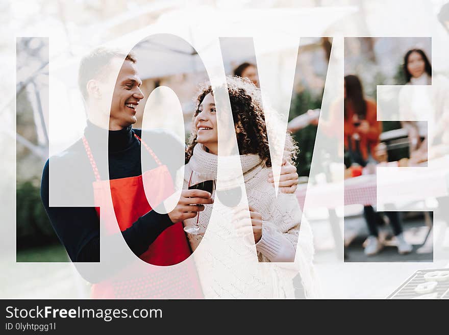 Man And Woman Outside Barbecue Wine Drinking. Smoked Food. Nature Activity. Outside Relaxing Activity Concept. Smiling Friends Are Having Fun. Resting Together. Sunny Day. Sweater Weather.