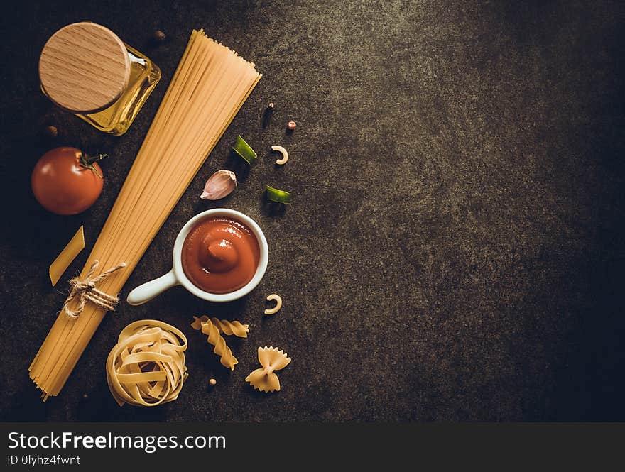 Pasta and food ingredient on dark background. Pasta and food ingredient on dark background