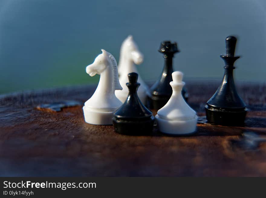 Macro chess pieces in motion with defocused background. Macro chess pieces in motion with defocused background.