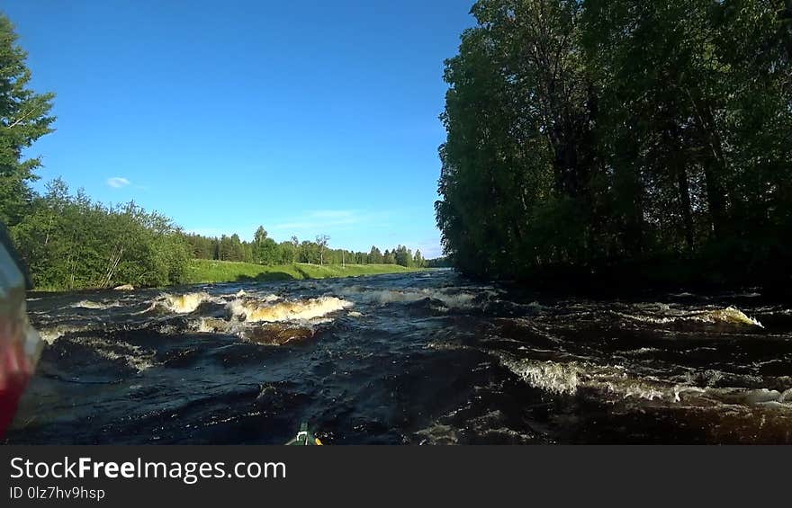 River rafting kayaking. Overcoming water rapids by boat. Rowing paired paddle. Extreme sports. Water sports. Shooting