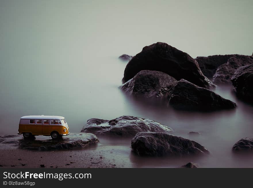 Miniature VW Bulli 1962 in the river. The cult car of the Hippie generation and it remained the status vehicle of the high wave surfers