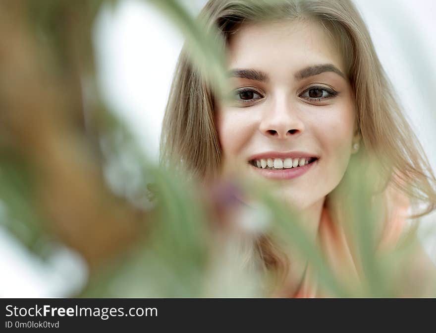 Portrait of smiling woman face on blurred background.photo with copy space