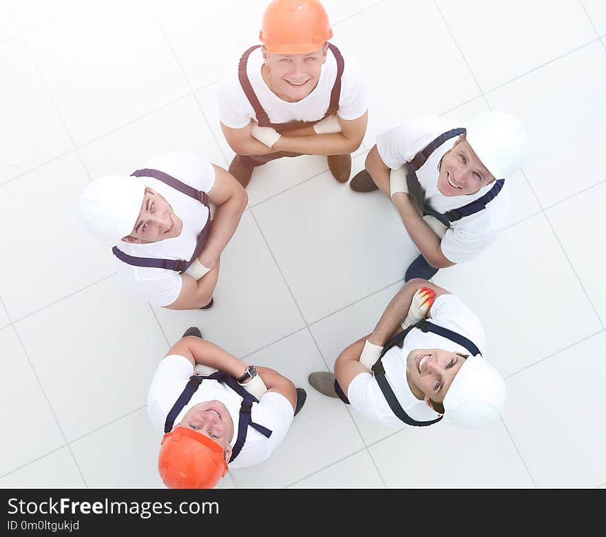 Group of workers standing in circle top view. Group of workers standing in circle top view