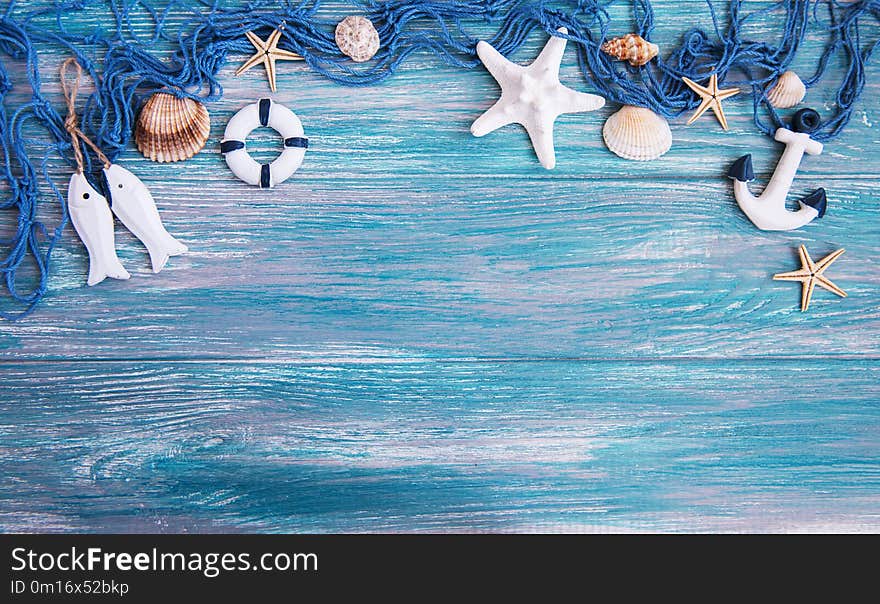 Fishing net with starfish on a wooden background