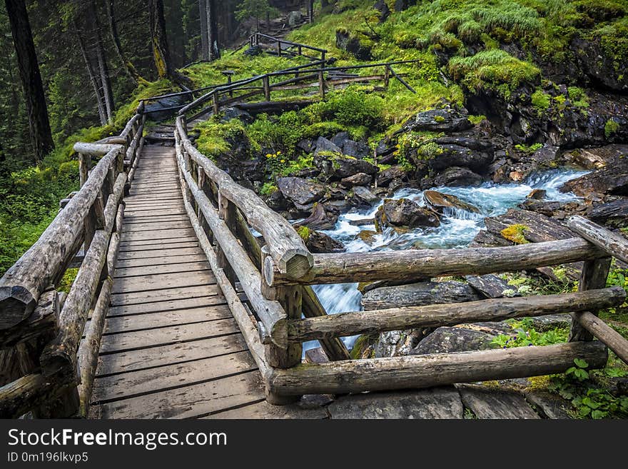 Wood bridge on italian alps