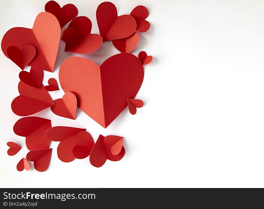 Red paper hearts on white background, copy space