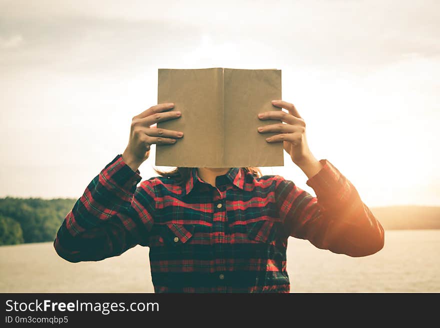 Women read books in quiet nature.