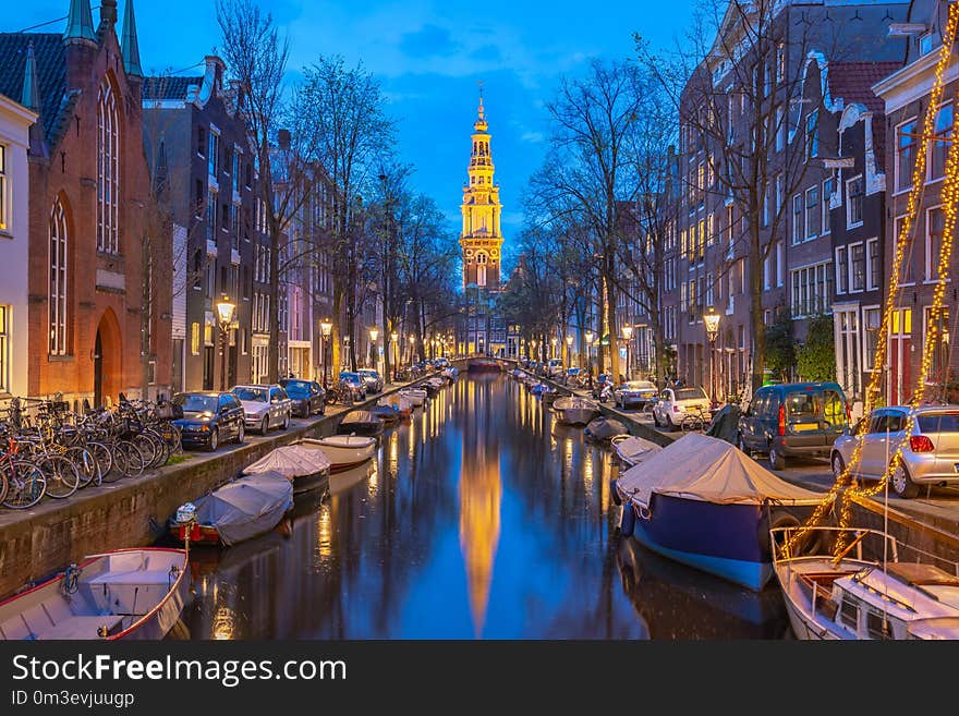 View of Zuiderkerk church at night in Amsterdam city, Netherlands.