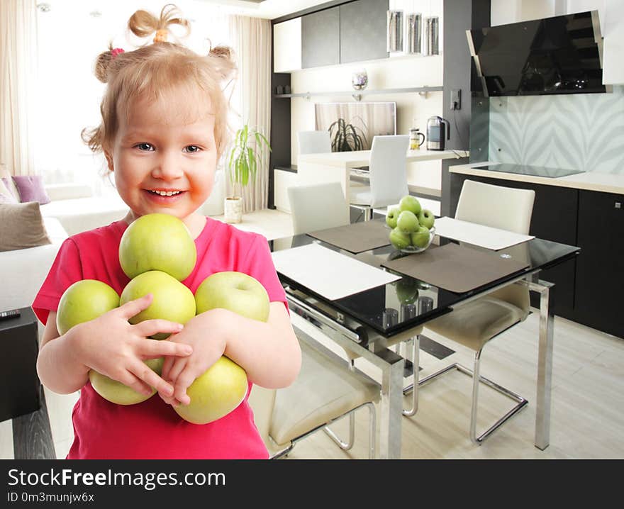 Happy little girl with apples at home. Happy little girl with apples at home