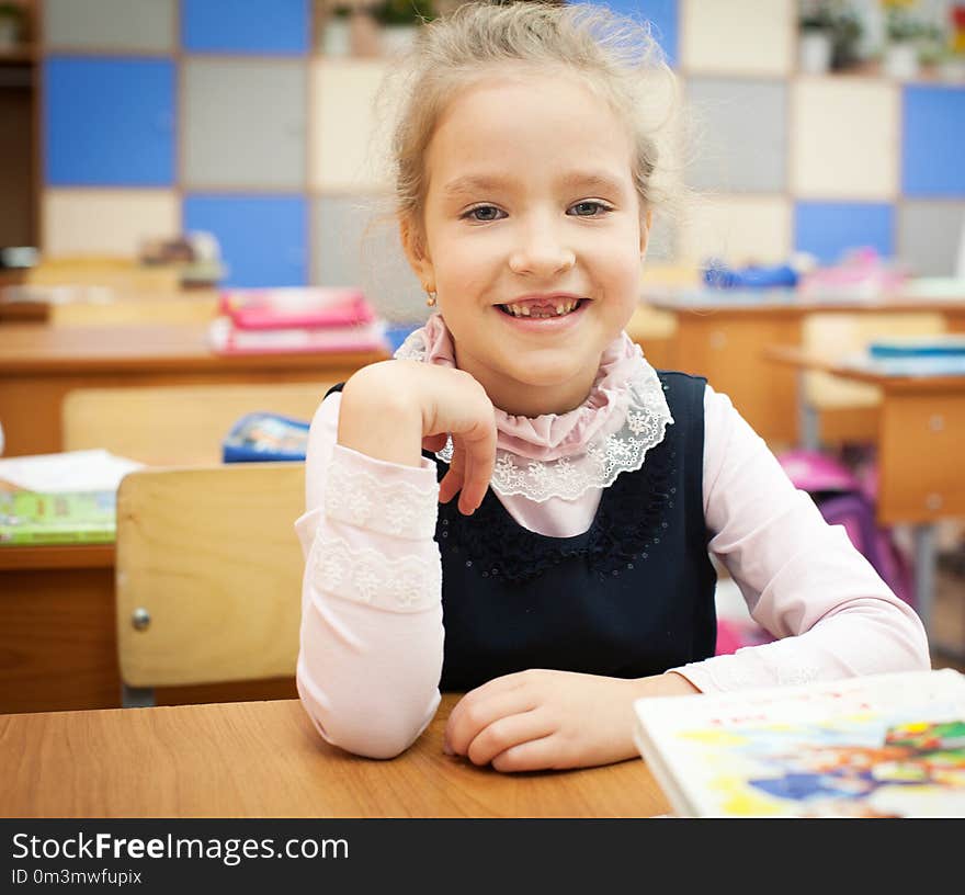 Girl at classroom. Children at school