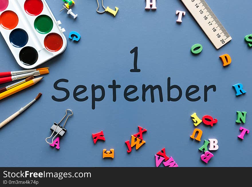 1st September. Image of september 1, calendar on blue background with office supplies. Back to school concept.