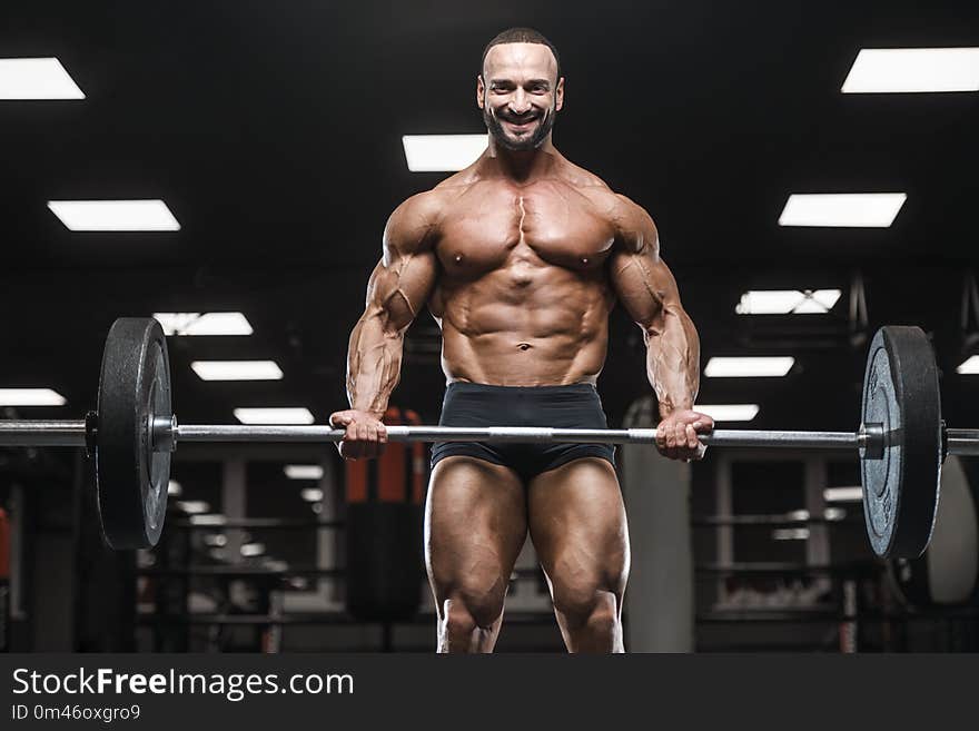 Brutal Strong Bodybuilder Athletic Men Pumping Up Muscles With D