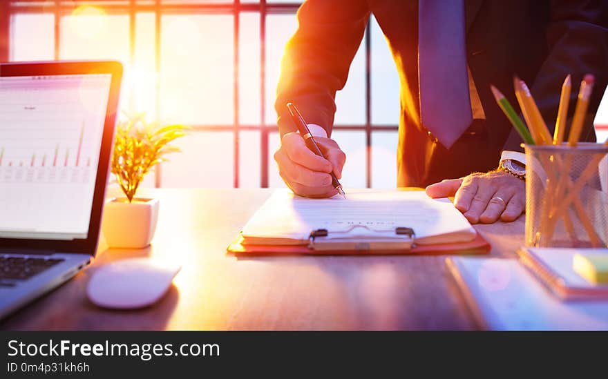 Businessman Signing A Contract In A Office