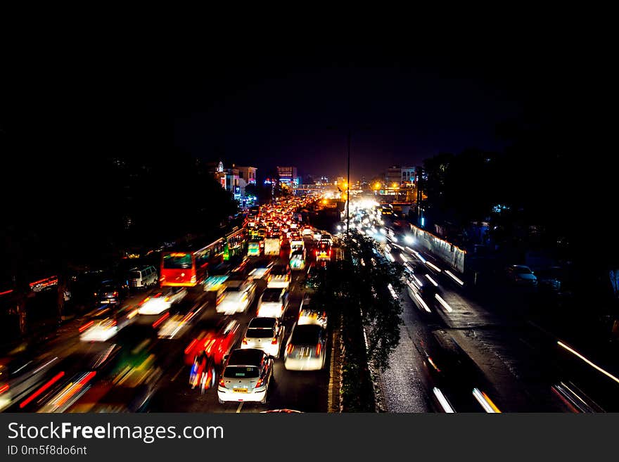 Heavy car traffic in the city center of Delhi, India at night