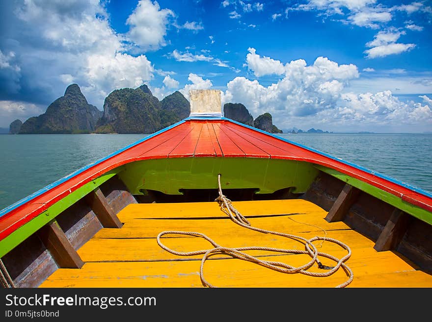 Boat trip to tropical islands from Phuket, Krabi in Thailand. Green mountains and blue water lagoon