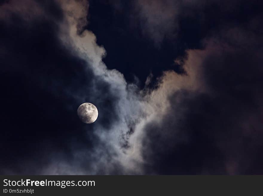 Full Moon In The Middle Of Clouds