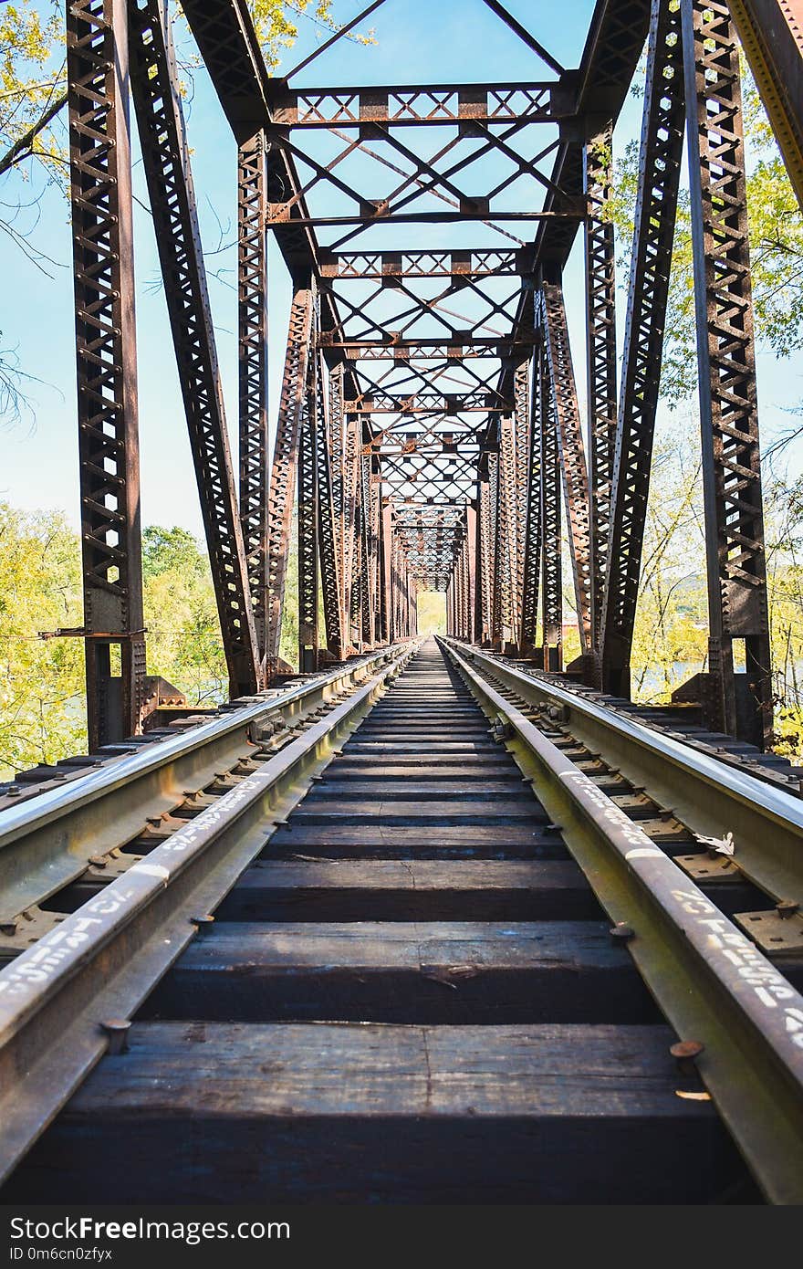 Looking down thetracks on a train bridge