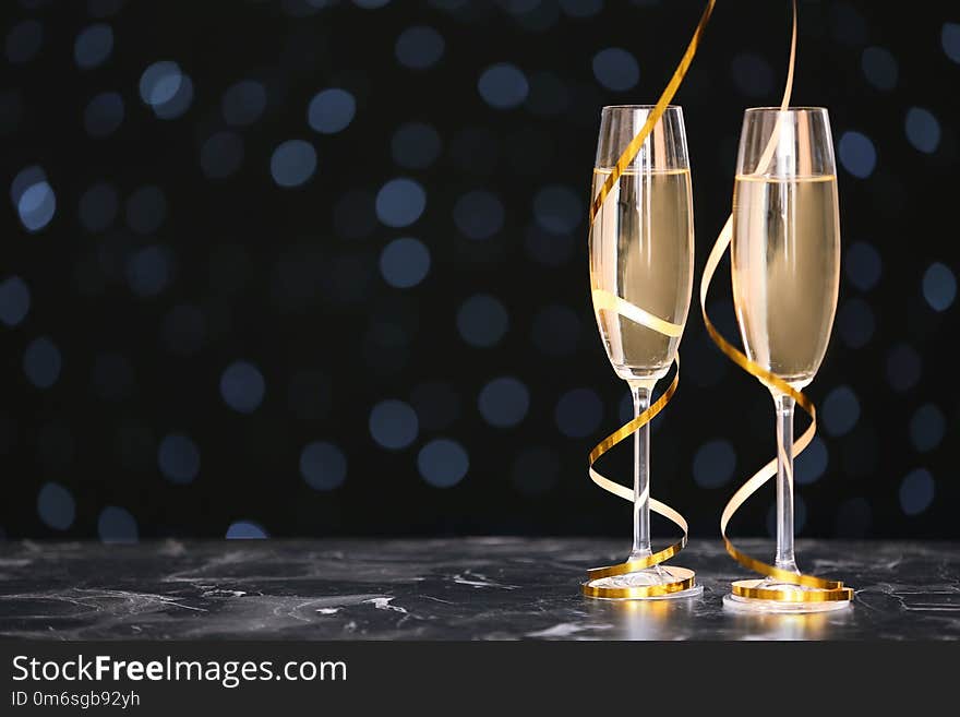 Glasses with champagne and space