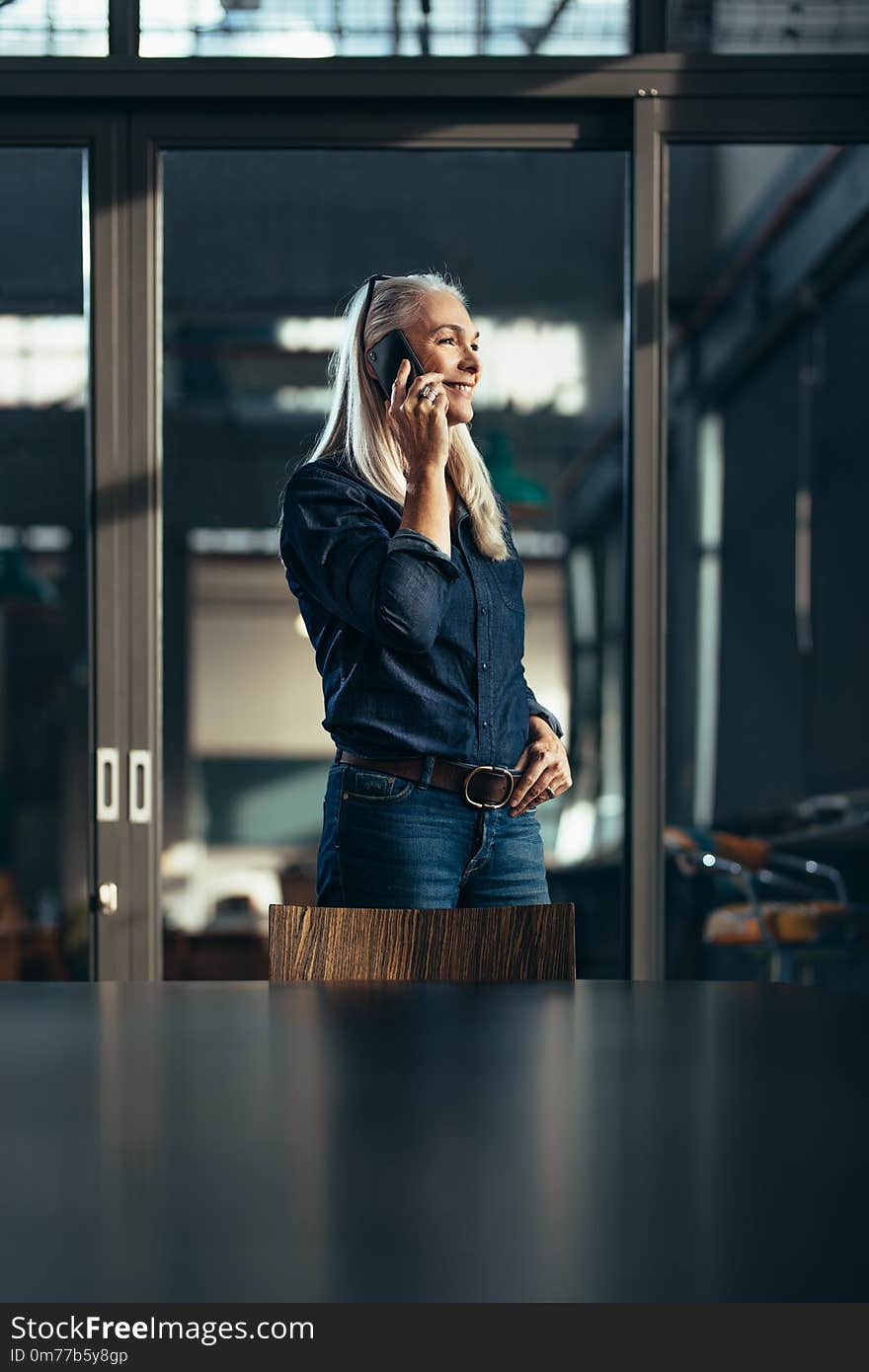 Businesswoman talking to clients over phone