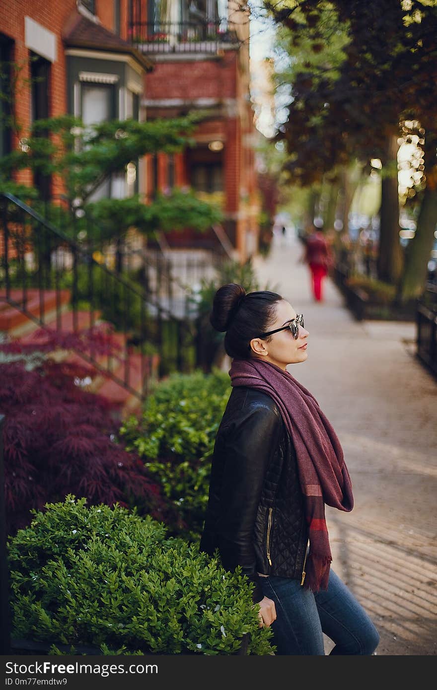 Young beautiful girl standing on the street in Chicago