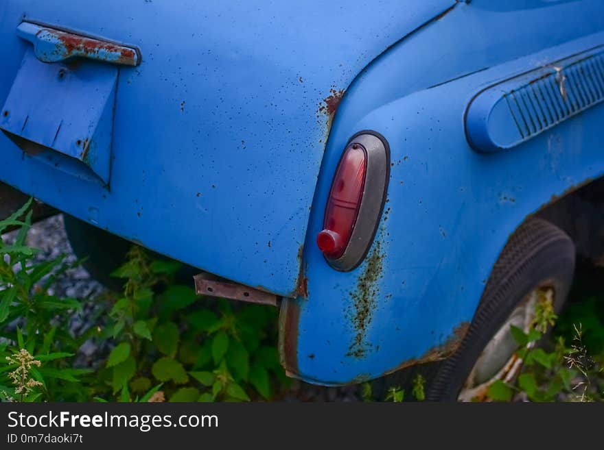 Rear part of bright blue old automobile