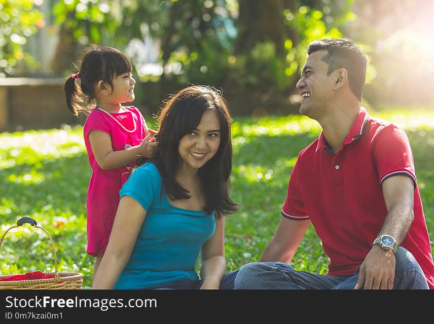 Happy family having a good morning in a park. Happy family having a good morning in a park