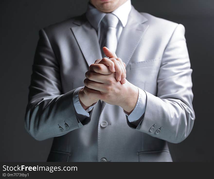 Close up.businessman showing gesture of support.isolated on black background.