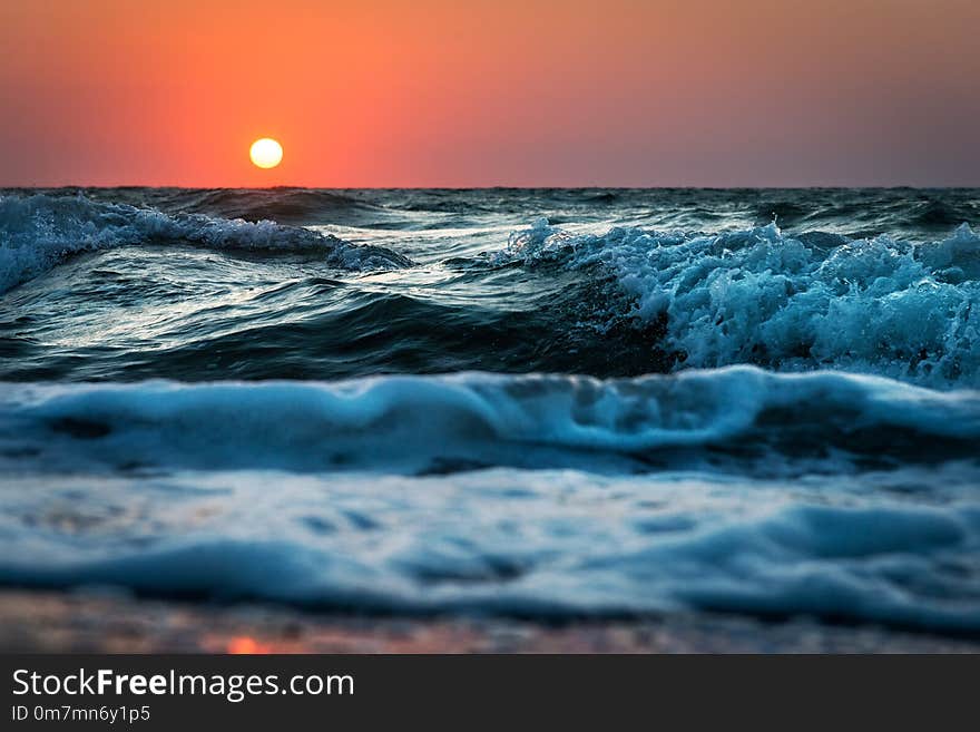 Sea wave close up, sunrise