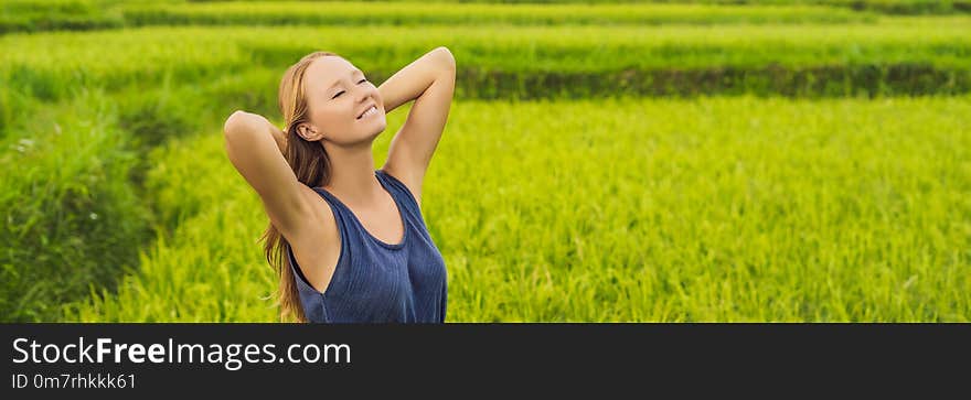 Young woman on Green cascade rice field plantation. Bali, Indonesia BANNER, long format