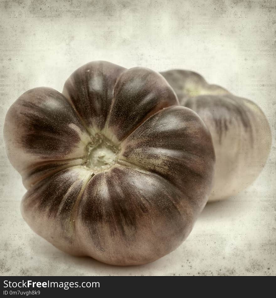 Textured old paper background with blue tomatoes