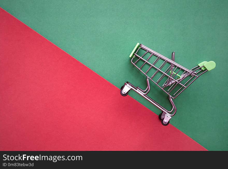 Shopping cart isolated on green red background. Shopping cart isolated on green red background.
