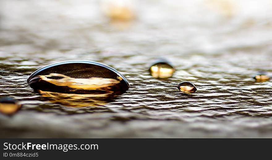 Gold Water drops closeup on Abstract silver foil background festive luxury concept. Gold Water drops closeup on Abstract silver foil background festive luxury concept