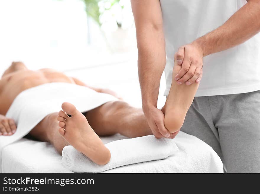 Young Woman Receiving Massage In Salon