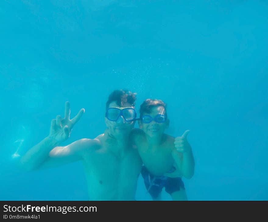 Father and son underwater