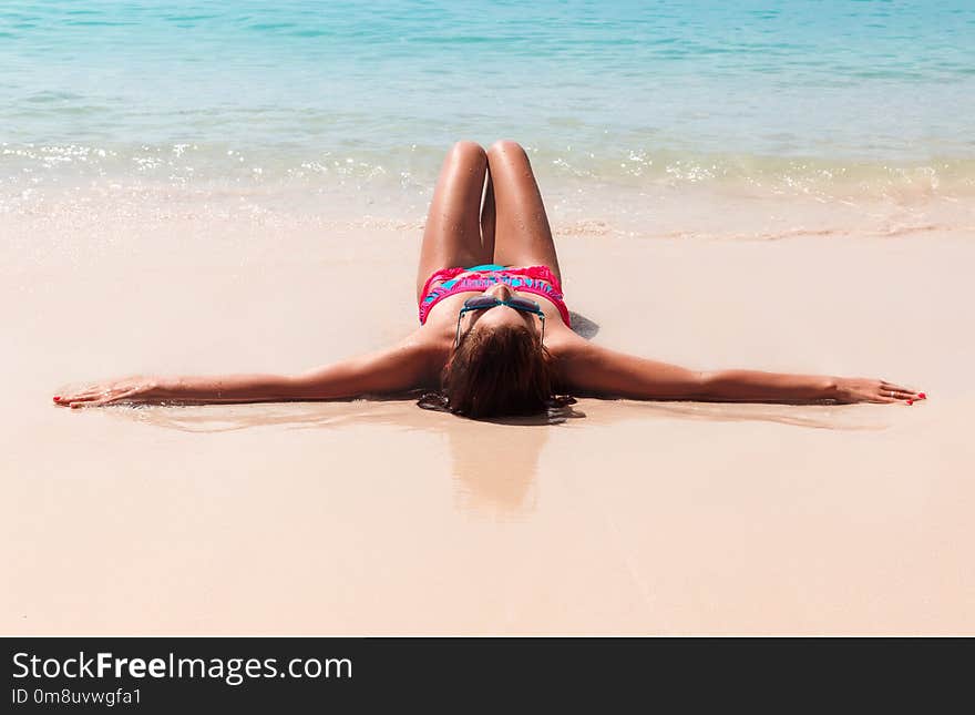 Young Pretty Slim Brunette Woman In Sunglasses Getting Suntan On