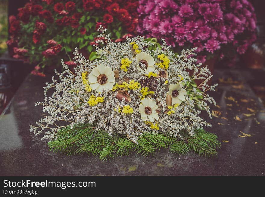 Decoration from dry colorful flowers in the cemetery at All Saints Day in autumn time. Decoration from dry colorful flowers in the cemetery at All Saints Day in autumn time