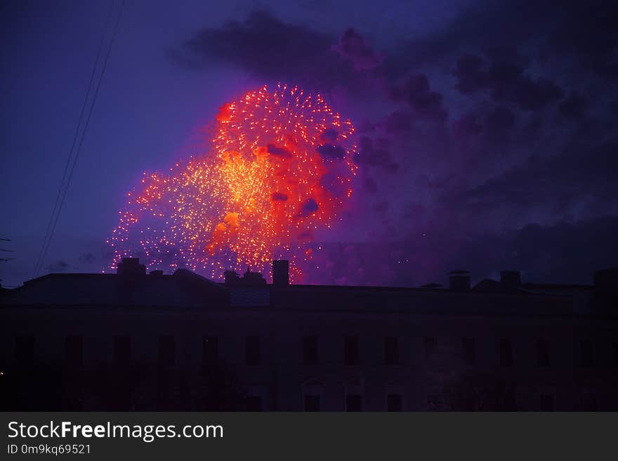 Colorful bright fireworks on roof top silhouette, magic holiday