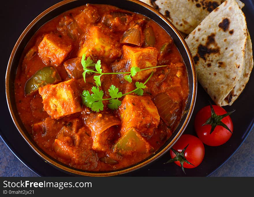 Indian Paneer curry served with roti