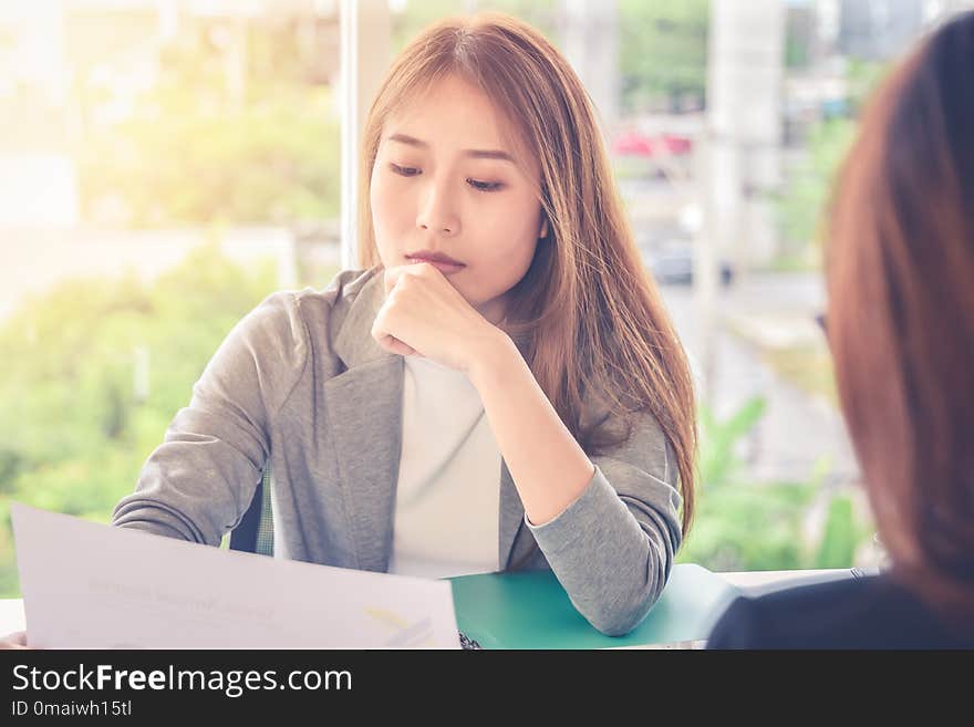 Woman submits an application form to an interviewer,Applying for new job,career opportunity concept : Executive